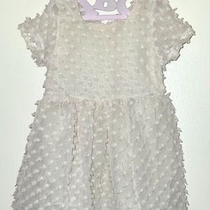 Beige dress with little dots, has a cover underneath, minor break on waist area